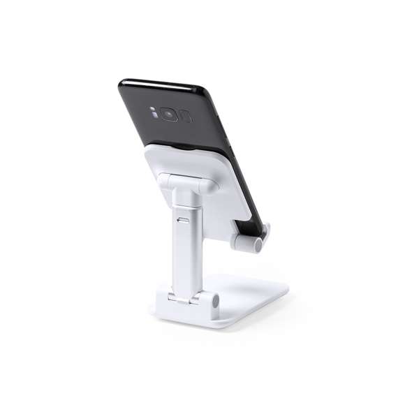 Soporte plegable para smartphones y tablets. Regulable en altura, incluye protecciones de goma antideslizantes en base y soporte. En sobrio acabado de color blanco y con amplia superficie de marcaje, especialmente indicado para impresión en tampografía. Presentado en atractiva caja de diseño.