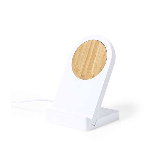 Cargador inalámbrico magnético de línea nature con función soporte para móvil. Cargador inalámbrico fabricado en bambú, y carcasa en PLA -Ácido PoliLáctico-, que se obtiene a partir de recursos 100% naturales como el almidón de maíz, la yuca o la caña de azúcar, pudiendo convertirse en 100% compostable al final de su ciclo de vida útil. Con función carga rápida de 10W y compatible con dispositivos equipados con tecnología de carga inalámbrica. Incluye anilla metálica adhesiva. Cable con conexión USB de 100 cm. Amplia superficie de marcaje, presentado en atractiva caja de diseño eco.Distintivo PLA sobre el artículo.