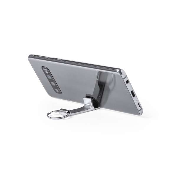 Llavero soporte para smartphone y tablet fabricado en aluminio de acabado mate, especialmente diseñado para marcaje en láser. Presentación individual en bolsita autocierre.