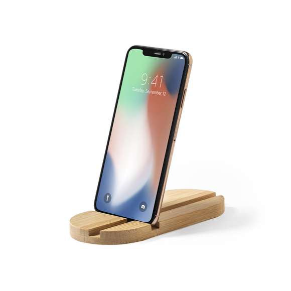 Original y sencillo soporte de línea nature para smartphone y tablet. Fabricado en bambú procedente de cortes naturales. Presentado en atractiva caja individual de diseño eco.