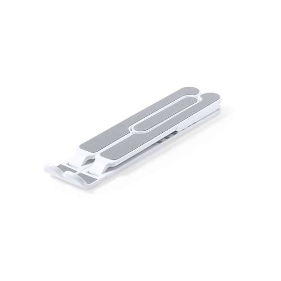 Soporte plegable para portátil. Fabricado en resistente ABS con protecciones antideslizantes en TPR para un firme ajuste al dispositivo. Regulable en altura, con plegado de tamaño compacto y presentado en funda de antelina con cierre de cordón y en caja individual de diseño.