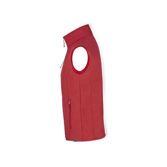 Chaleco impermeable y transpirable en combinación de materiales RPET, elaborados a partir de plástico reciclado, para así fomentar la reutilización de residuos plásticos y contribuir a la sostenibilidad del planeta: exterior en soft shell y elastano de 300g/m2 con interior en 100% poliéster microfleece. Con distintivo eco en dobladillo inferior de la prenda.  Resistente al viento y al agua con cierre principal y bolsillos frontal en pecho y laterales de cremallera invisible y tiradores a juego. Disponible en variada gama de colores y en tallas S, M, L, XL, XXL.