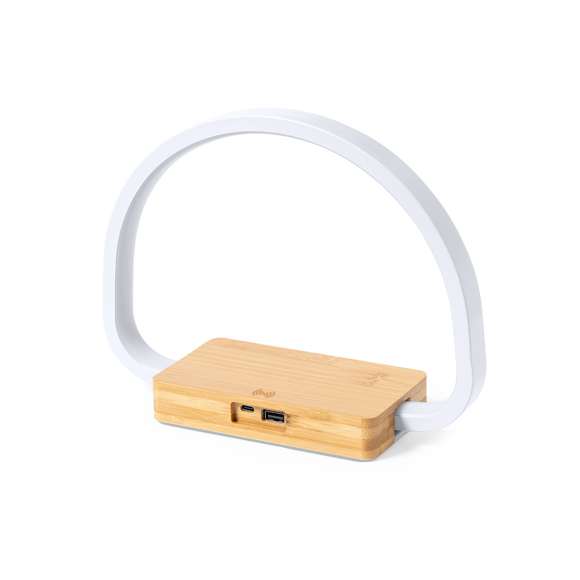 Lámpara cargador de diseño eco. Fabricada en bambú procedente de cortes naturales y con base antideslizante. Cargador inalámbrico 10W integrado. Incluye 52 LEDs y 3 posiciones de iluminación (cálida, fría y media), con intensidad de luz regulable. Compatible con dispositivos móviles de carga inalámbrica y conexión USB. Incluye cable cargador Tipo C y viene presentada en una atractiva caja de diseño eco. Disponible manual de instrucciones en español e inglés.