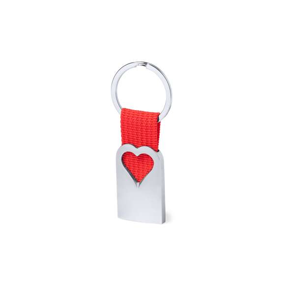Original llavero corazón con cuerpo en aluminio reciclado de acabado plateado. Cuerpo con corazón troquelado y cinta en color. Amplia superficie de marcaje y distintivo aluminio reciclado. Con anilla llavero metálica a juego y presentado en bolsa individual con cartón kraft.El aluminio reciclado es un material con posibilidades de reciclaje casi infinitas, sin perder sus propiedades originales y consumiendo menos energía en este proceso.