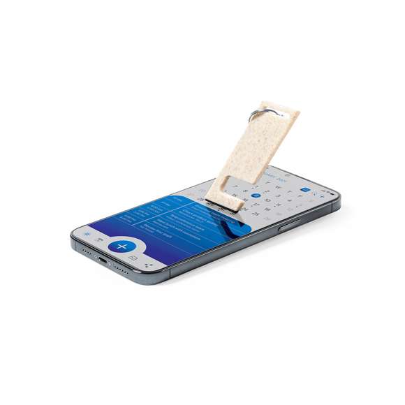 Llavero multifunción de línea nature fabricado en caña de trigo, para así fomentar la utilización de materias primas naturales y reducir las emisiones contaminantes. Con soporte para smartphone integrado y accesorio limpiapantallas incluido. Con distintivo caña de trigo en el cuerpo del llavero.