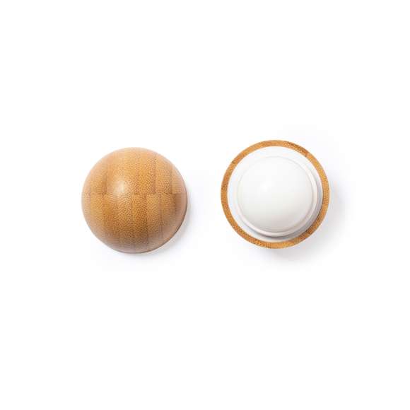  	Bálsamo labial de línea nature, con aroma vainilla y protección SPF15. En envase dosificador roll-on de bambú, con tapa a rosca.