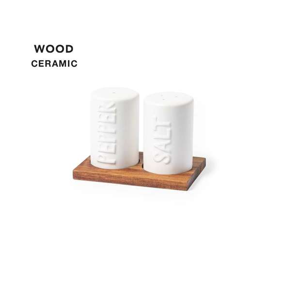  	Set de salero y pimentero en blanco y fabricados en cerámica. Incluye base en madera natural de acacia, troquelada para encajar el salero y el pimentero. Presentación en caja individual de diseño kraft.
