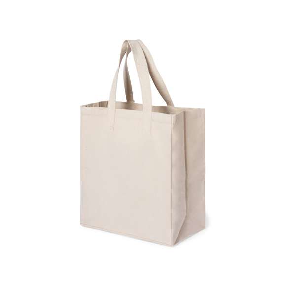 Bolsa XL de gran capacidad fabricada en algodón 100%, de acabado natural y en gramaje extra de 310g/m2. De acabado cosido y con fuelle. Asas largas extra anchas y reforzadas (72 x 3,5 cm). Resistencia hasta 10 kg de peso.