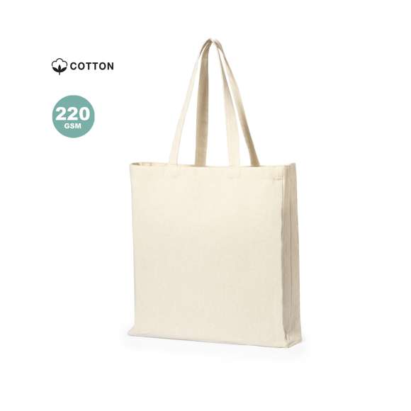 Bolsa fabricada en algodón 100%, de acabado natural y en 220g/m2. De acabado cosido, con fuelle en base y asas medianas reforzadas (60 x 2,5 cm). Resistencia hasta 10 kg de peso.