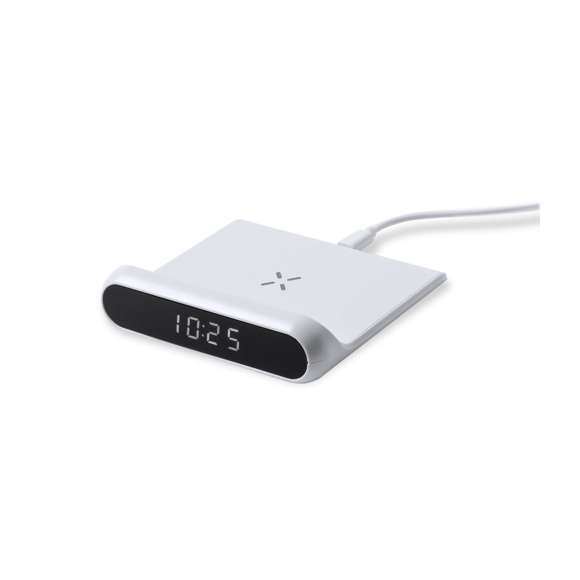 Reloj multifunción con pantalla retroiluminada y cargador inalámbrico 10W integrado. De elegante diseño en color blanco, con funciones hora y alarma. Cable de carga Tipo C de 1 m incluido y compatible con dispositivos equipados con tecnología de carga inalámbrica Qi. Presentado en caja individual de diseño kraft, con manual de instrucciones en español en inglés.Fabricado conforme a los estándares RoHS y en cumplimiento con los siguientes requisitos de seguridad:Sistema de protección contra sobrecalentamiento.Sistema de protección contra sobrecarga.Sistema de bloqueo para evitar cortocircuitos.