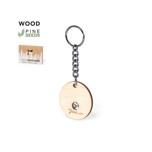 Llavero en suave y elegante madera de haya. Incluye cápsula con semillas de pino. Un respetuoso y sostenible regalo con el que fomentar y promover el cuidado del medio ambiente. Presentado en caja individual de diseño kraft.