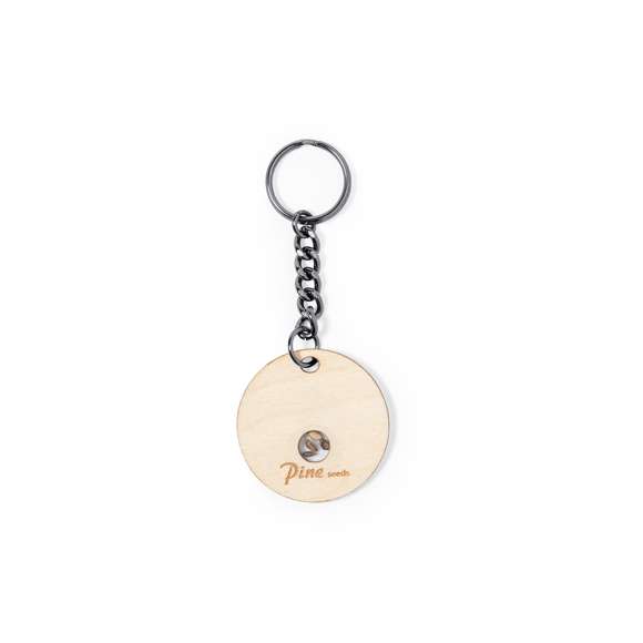 Llavero en suave y elegante madera de haya. Incluye cápsula con semillas de pino. Un respetuoso y sostenible regalo con el que fomentar y promover el cuidado del medio ambiente. Presentado en caja individual de diseño kraft.