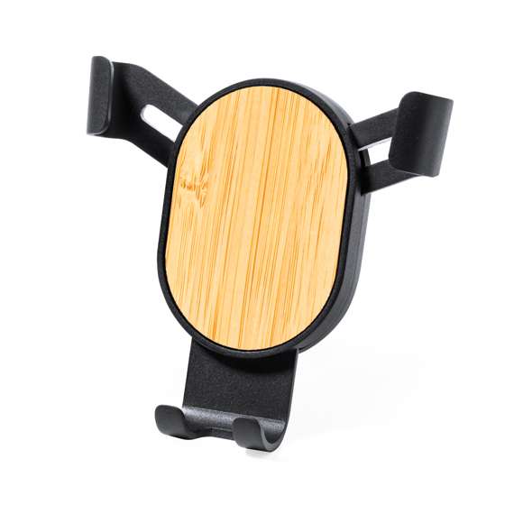 Ingenioso soporte para smartphone de diseño minimalista y especialmente diseñado para smartphones tamaño XXL. Elegante diseño negro con detalles en bambú, con sistema de fijación universal que se adapta por el propio peso del teléfono, ajustando las pinzas de agarre una vez que se sitúa el dispositivo en el soporte, con base rotatoria 360º. Para rejilla de ventilación del automóvil y con frontal especialmente diseñado para marcaje. Presentado en caja de diseño kraft. Materiales como el bambú fomentan la utilización de materias primas naturales, reduciendo las emisiones contaminantes. Proviene de una planta de gran resistencia y versatilidad, con crecimiento y regeneración rápidos, siendo una excelente alternativa al uso de madera tradicional.