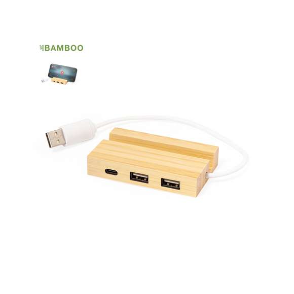Puerto USB 2.0 fabricado en bambú. Con 1 puerto Tipo C y 2 puertos USB. Además, incluye un práctico soporte para smartphone o tablet. Presentado en atractiva caja de diseño eco.Materiales como el bambú fomentan la utilización de materias primas naturales, reduciendo las emisiones contaminantes. Proviene de una planta de gran resistencia y versatilidad, con crecimiento y regeneración rápidos, siendo una excelente alternativa al uso de madera tradicional.