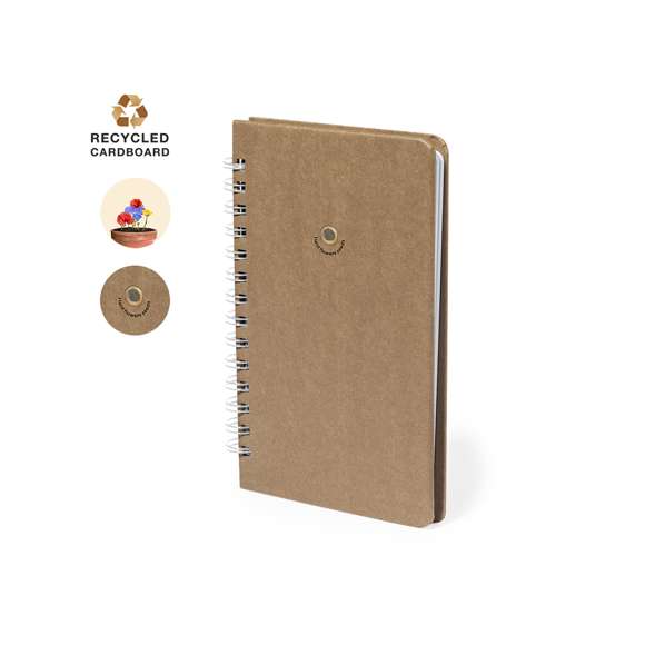 Libreta de semillas, con anillas y tapas rígidas, fabricada en resistente cartón reciclado. Incluye 80 hojas interiores, con disposición a una raya en papel reciclado. Además, en la portada contiene una cápsula con semillas de flores silvestres, en colores surtidos y con instrucciones de plantado en la cubierta trasera.El cartón reciclado proviene del reaprovechamiento de excedente de fabricaciones y reciclaje de papel en el final de su vida útil, convirtiéndose en un lienzo ecológico y sostenible.