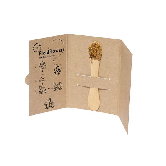 Stick con semillas. En uno de los extremos tiene una zona amplia para marcaje y en el otro extremo incluye semillas de flores silvestres listas para plantar. Presentado en una tarjeta de cartón reciclado con instrucciones de plantado.