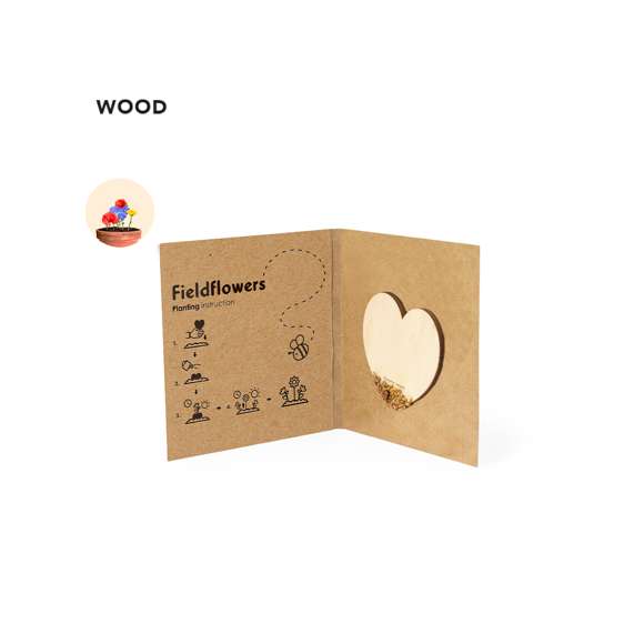 Corazón de semillas fabricado en madera natural, con semillas de flores silvestres listas para plantar. Presentado en una elegante tarjeta de cartón reciclado, con instrucciones de plantado y amplia superficie de marcaje.