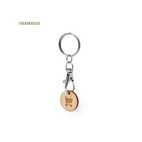 Llavero moneda fabricado en bambú. Con cierre de mosquetón giratorio y anilla para llaves. Incluye moneda fabricada en bambú con un grabado en forma del carro de la compra.Materiales como el bambú fomentan la utilización de materias primas naturales, reduciendo las emisiones contaminantes. Proviene de una planta de gran resistencia y versatilidad, con crecimiento y regeneración rápidos, siendo una excelente alternativa al uso de madera tradicional.