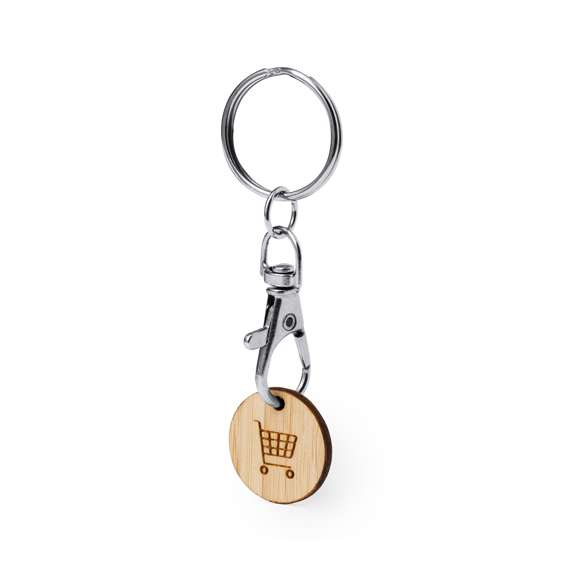 Llavero moneda fabricado en bambú. Con cierre de mosquetón giratorio y anilla para llaves. Incluye moneda fabricada en bambú con un grabado en forma del carro de la compra.Materiales como el bambú fomentan la utilización de materias primas naturales, reduciendo las emisiones contaminantes. Proviene de una planta de gran resistencia y versatilidad, con crecimiento y regeneración rápidos, siendo una excelente alternativa al uso de madera tradicional.