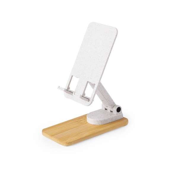 Soporte plegable para smartphones y tablets, fabricado en caña de trigo y con base en resistente bambú. Regulable en altura, con almohadillas de goma antideslizantes en base y soporte. Amplia superficie de marcaje, especialmente indicado para impresión en tampografía en el soporte y en láser en la base. Materiales como el bambú fomentan la utilización de materias primas naturales, reduciendo las emisiones contaminantes. Proviene de una planta de gran resistencia y versatilidad, con crecimiento y regeneración rápidos, siendo una excelente alternativa al uso de madera tradicional.La caña de trigo fomenta la utilización de materias primas naturales, reduciendo así las emisiones contaminantes.