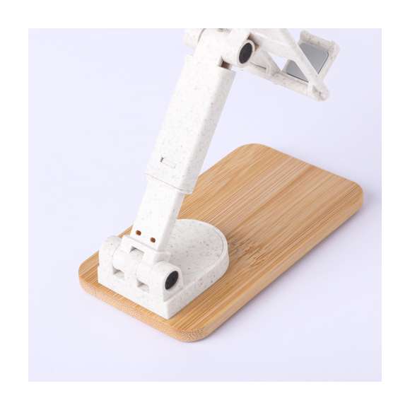 Soporte plegable para smartphones y tablets, fabricado en caña de trigo y con base en resistente bambú. Regulable en altura, con almohadillas de goma antideslizantes en base y soporte. Amplia superficie de marcaje, especialmente indicado para impresión en tampografía en el soporte y en láser en la base. Materiales como el bambú fomentan la utilización de materias primas naturales, reduciendo las emisiones contaminantes. Proviene de una planta de gran resistencia y versatilidad, con crecimiento y regeneración rápidos, siendo una excelente alternativa al uso de madera tradicional.La caña de trigo fomenta la utilización de materias primas naturales, reduciendo así las emisiones contaminantes.