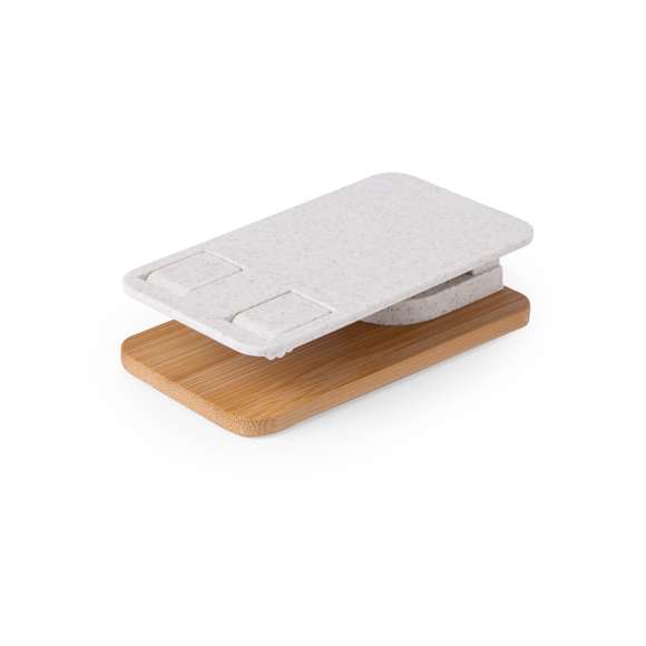 Soporte plegable para smartphones y tablets, fabricado en caña de trigo y con base en resistente bambú. Regulable en altura, con almohadillas de goma antideslizantes en base y soporte. Amplia superficie de marcaje, especialmente indicado para impresión en tampografía en el soporte y en láser en la base. Materiales como el bambú fomentan la utilización de materias primas naturales, reduciendo las emisiones contaminantes. Proviene de una planta de gran resistencia y versatilidad, con crecimiento y regeneración rápidos, siendo una excelente alternativa al uso de madera tradicional.La caña de trigo fomenta la utilización de materias primas naturales, reduciendo así las emisiones contaminantes.