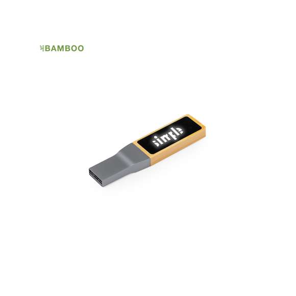 Memoria USB de 16GB de capacidad. Fabricada en bambú, con amplia y elegante zona de marcaje iluminada. Presentada en atractiva caja de diseño kraft.Materiales como el bambú fomentan la utilización de materias primas naturales, reduciendo las emisiones contaminantes. Proviene de una planta de gran resistencia y versatilidad, con crecimiento y regeneración rápidos, siendo una excelente alternativa al uso de madera tradicional.