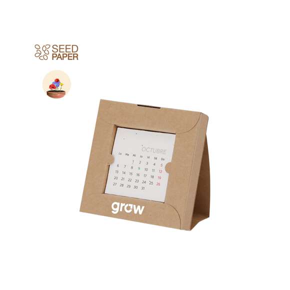 Calendario plantable fabricado en papel de semilla. Incluye 13 hojas con semillas de petunia de colores surtidos, convirtiéndolo en papel plantable después de su vida útil. Diseño de mes en curso, con festividades nacionales marcadas en rojo y autonómicas en verde. Presentado en caja soporte de cartón.