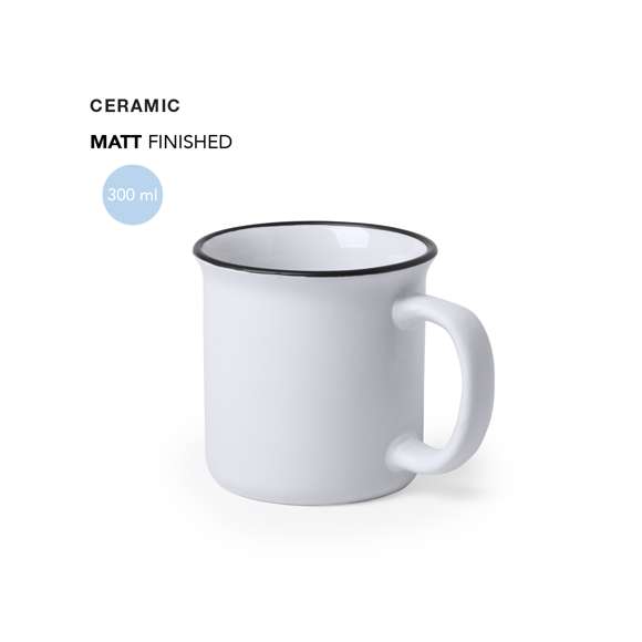 Taza de cerámica de 300ml de capacidad con diseño vintage. En sobrio diseño bicolor, con anilla en el borde. Presentada en caja individual.Disponible manual de instrucciones en español e inglés.
