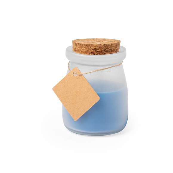  	Original vela tarrito de cristal. Con tapón de corcho y etiqueta de cartón reciclado con hilo para mensajitos. Disponible en varios colores y presentada en caja blanca individual.