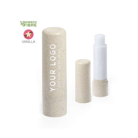 Barra de bálsamo labial de línea nature, fabricada en fibra de bambú. Tipo SPF15, con aroma vainilla y disponible en colores natural y verde eco.