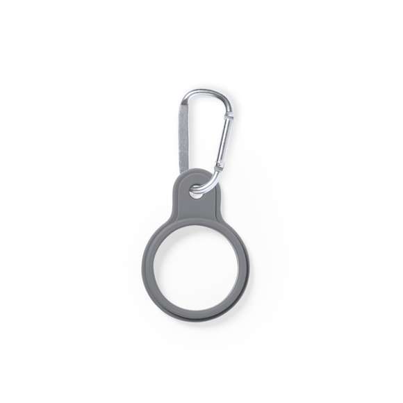 Original colgador para transportar el bidón. Fabricado en resistente silicona, con mosquetón de transporte de aluminio. Disponible en variada gama de colores, con lado liso para impresión. Disponible manual de instrucciones en español e inglés.