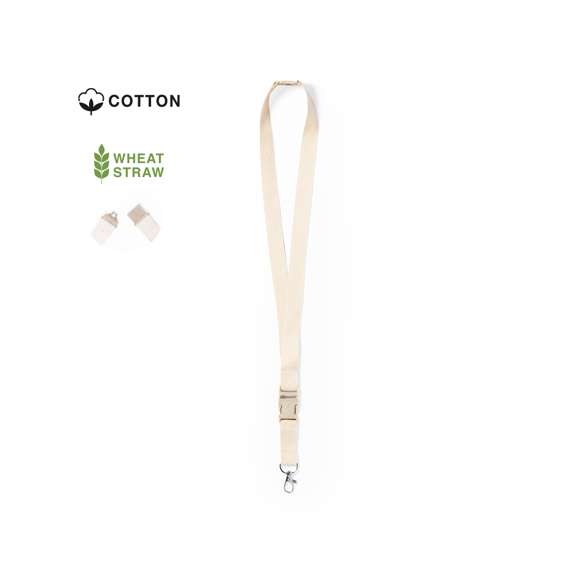 Lanyard de línea nature en material 100% algodón. Hebilla y cierre de seguridad en cuello de caña de trigo/PP, para así fomentar la utilización de materias primas naturales y reducir las emisiones contaminantes. Con mosquetón metálico giratorio y disponible en color natural.