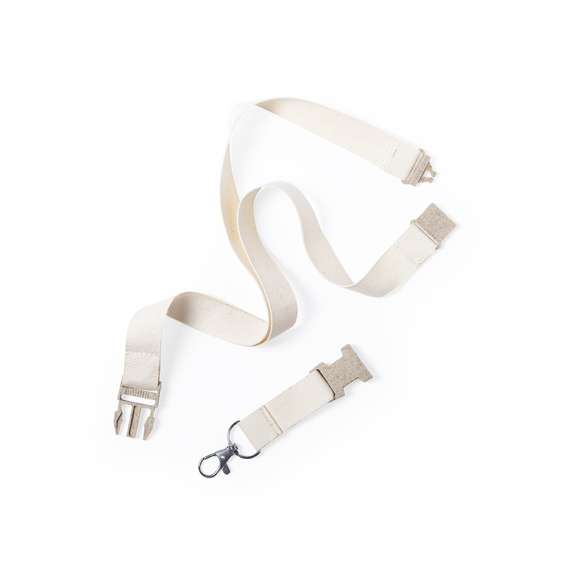 Lanyard de línea nature en material 100% algodón. Hebilla y cierre de seguridad en cuello de caña de trigo/PP, para así fomentar la utilización de materias primas naturales y reducir las emisiones contaminantes. Con mosquetón metálico giratorio y disponible en color natural.