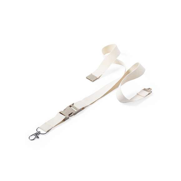 Lanyard de línea nature en material 100% algodón. Hebilla y cierre de seguridad en cuello de caña de trigo/PP, para así fomentar la utilización de materias primas naturales y reducir las emisiones contaminantes. Con mosquetón metálico giratorio y disponible en color natural.
