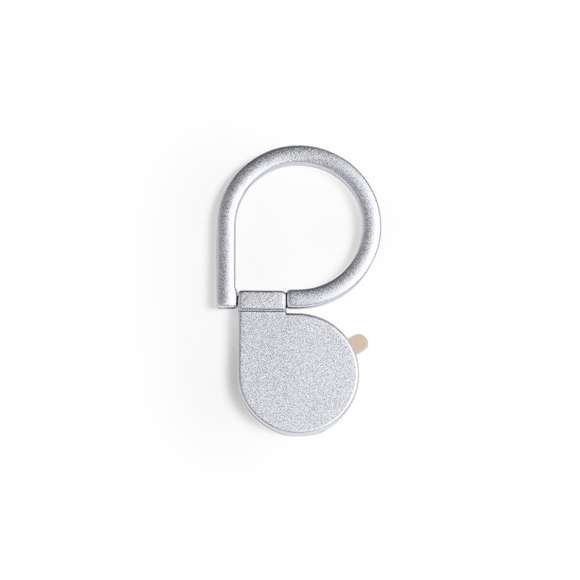 Soporte metálico para smartphone en acabado mate. De elegante diseño y con adhesivo 3M, de fijación extra fuerte y libre de residuos al despegarlo del dispositivo. Con anilla soporte posterior para dedo y presentado en bolsita individual de diseño.