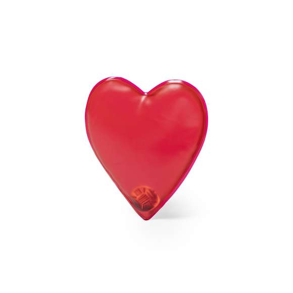 Parche térmico con diseño corazón. Reutilizable y con efecto calor de duración prolongada. Se activa doblando la chapa metálica para que el parche se endurezca y se caliente. Para reutilizar, se calienta agua en un recipiente con el parche dentro hasta que el gel interior vuelva a su estado líquido, presionando la chapa metálica de nuevo. Disponible manual de instrucciones en español e inglés.
