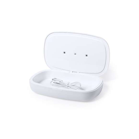 Caja esterilizadora de línea nature, con base de carga en bambú. Luz ultravioleta tipo C, con cargador inalámbrico 5W para smartphone integrado en tapa. Especialmente diseñada para la eliminación de microorganismos y bacterias en objetos de uso cotidiano como el smartphone, llaves, gafas, mascarilla, auriculares, smartwatch... Fabricada en resistente material ABS de acabado mate y presentada en atractiva caja individual de diseño.  Fácil de usar, basta con introducir el objeto dentro de la caja. Potencia de bombilla 1W longitud de onda de 270-280 nm, con alimentación mediante cable USB Tipo C de 1m de largo con color a juego. Tiempo de esterilización de 5 y 10 minutos con función auto-apagado.  Disponible manual de usuario en español e inglés. Disponible certificación CE, RoHS y de efectividad germicida.