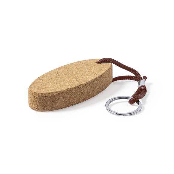 Llavero flotante de línea nature, fabricado en en corcho natural, fomentando la utilización de materiales naturales y así ayudar a la sostenibilidad del planeta. Con cordón de poliéster y anilla metálica.