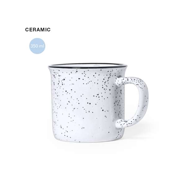 Taza de cerámica de 350ml de capacidad con diseño vintage. En combinación de exterior en colores moteados e interior a juego, con borde negro. Presentada en caja individual acabado kraft.