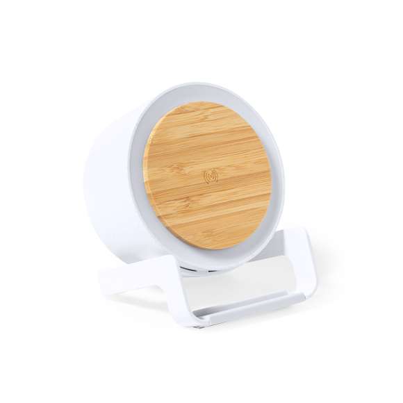 Lámpara multifunción Limited Edition con función altavoz, cargador inalámbrico y soporte para dispositivos móviles. Un moderno y sostenible diseño fabricado en bambú y carcasa en resistente ABS y caña de trigo, para así fomentar la utilización de materias primas naturales y reducir las emisiones contaminantes. Incluye función cargador inalámbrico 10W y lámpara de 12 ledes, con intensidad de luz regulable. Compatible con dispositivos móviles de carga inalámbrica, incluye cable cargador USB C de 100 cm. Altavoz Bluetooth con 3W de potencia. Disponible manual de instrucciones en Español e Inglés.  De la perfecta combinación entre exclusividad y diseño, nace Limited Edition, una colección especial de ideas promocionales de edidición limitada. Un nuevo concepto, inspirado en la fusión de artículos premium con las últimas y más novedosas tendencias y que cuenta con una seleción limitada de unidades, convirtiendo así un regalo en una experiencia única e inolvidable.  Exclusivo estuche de presentación Limited Edition, con diseño protegido por derechos de propiedad industrial.  Incluida tarjeta con descripción de Limited Edition en cartón reciclado.