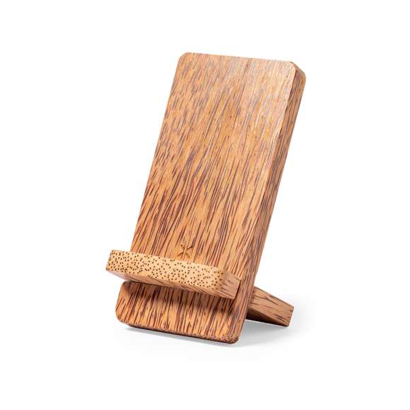 Cargador inalámbrico 15W de línea nature con función soporte para smartphone y fabricado en coco. Tras el consumo de su fruto, del coco y su planta se pueden obtener multitud de productos, contribuyendo a la sostenibilidad del planeta y fomentando el uso de materias primas naturales. Compatible con dispositivos equipados con tecnología de carga inalámbrica. Amplia superficie de marcaje y presentado en caja individual de diseño eco en cartón kraft.