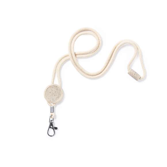 Lanyard de línea nature fabricado en resistente algodón 100%. Accesorio circular para personalización y cierre de seguridad en cuello fabricados en caña de trigo, con mosquetón metálico giratorio.La caña de trigo fomenta la utilización de materias primas naturales, reduciendo así las emisiones contaminantes.