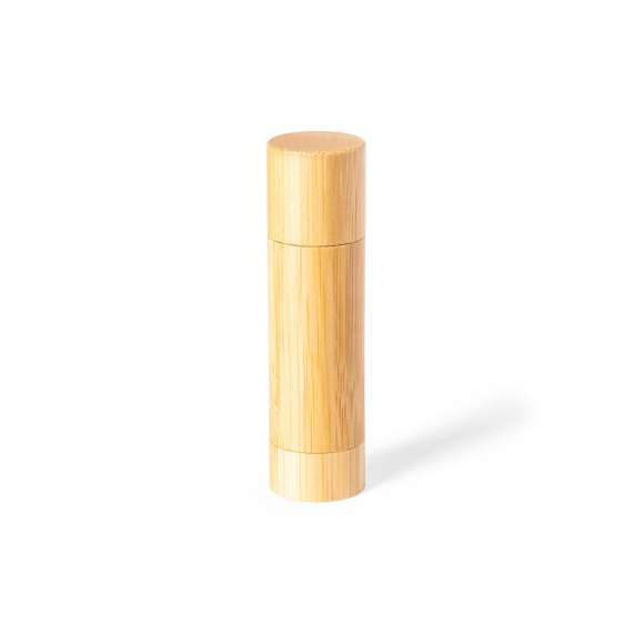 Bálsamo labial de línea nature, con aroma vainilla y protección SPF15. En envase dosificador de bambú con capucha.