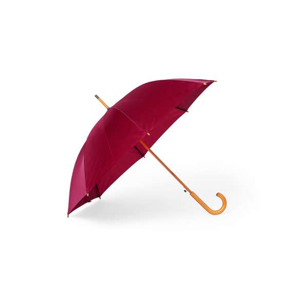 Paraguas de 8 paneles y 105 cm de diámetro, en resistente material poliéster 190T. De apertura automática, con mango curvado y caña, ambos en madera. Varillas metálicas en color negro, tira con cierre de velcro y disponible en variada gama de colores.
