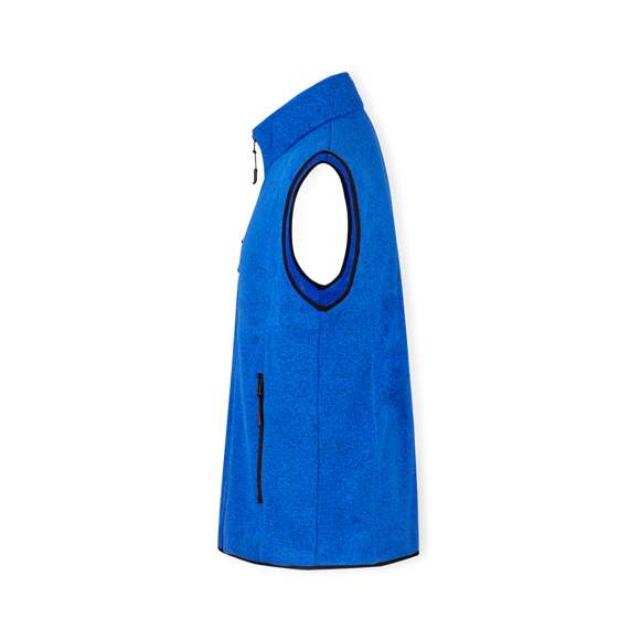 Chaleco de elegante diseño bitono en cálido y suave polar fleece de 280g/m2, con tratamiento anti-pilling, disponible en distintos colores. Cremallera central, bolsillos laterales y práctico bolsillo en el pecho, con cierres reforzados y tiradores en color negro. Con costuras laterales de aspecto moderno que aseguran un ajuste perfecto. Disponible en tallas XS, S, M, L, XL, XXL.