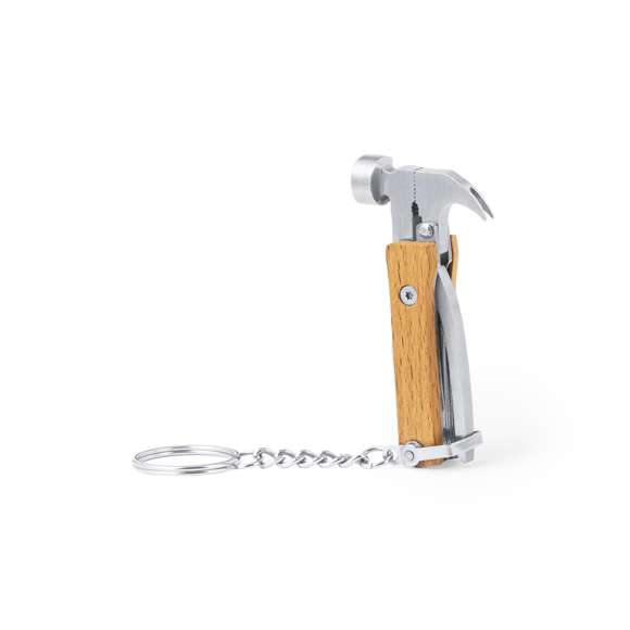 Práctico llavero multiherramienta fabricado en resistente acero inox y madera. Con 7 funciones: martillo, destornillador plano pequeño, alicates, cuchillo, pelacables, lima y abrebotellas. Presentado en caja individual de diseño kraft.