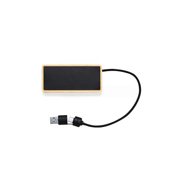 Puerto USB 2.0 fabricado en bambú y superficie en elegante color negro, con luz led interior y un recubrimiento exterior especialmente diseñado para marcaje en láser, iluminando así el logotipo. Incluye puerto Tipo C y 2 puertos USB, con entrada dual USB/Tipo C. Presentado en caja individual de diseño kraft.Fabricado conforme a estándares RoHS, con sistema de bloqueo para evitar cortocircuitos.