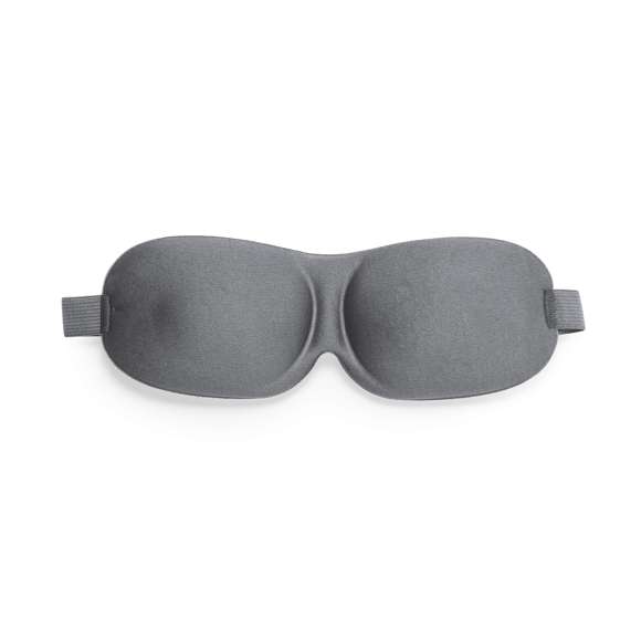 Cómoda máscara de viaje fabricada en suave poliéster. Máxima experiencia de descanso para los ojos, debido a que su diseño acolchado proporciona un bloqueo óptimo de la luz para un sueño reparador en cualquier lugar. El elástico regulable garantiza un ajuste cómodo y seguro. Presentado en bolsa individual de papel reciclado.