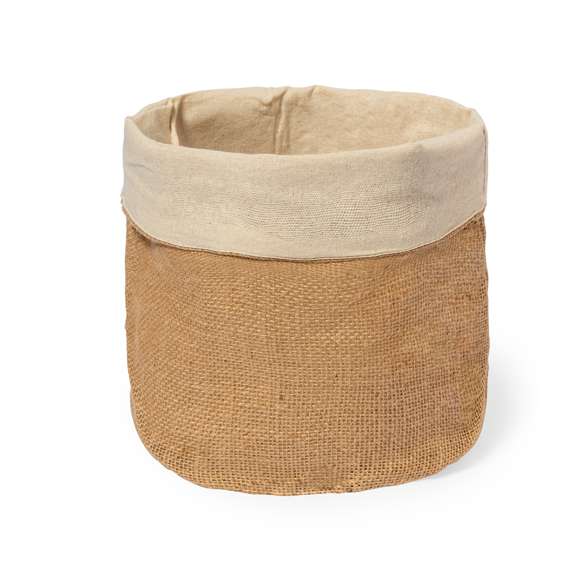 Panera elaborada con suave algodón 100% en el interior y yute en el exterior, con un diseño redondo. Presentada en bolsa individual reciclada.